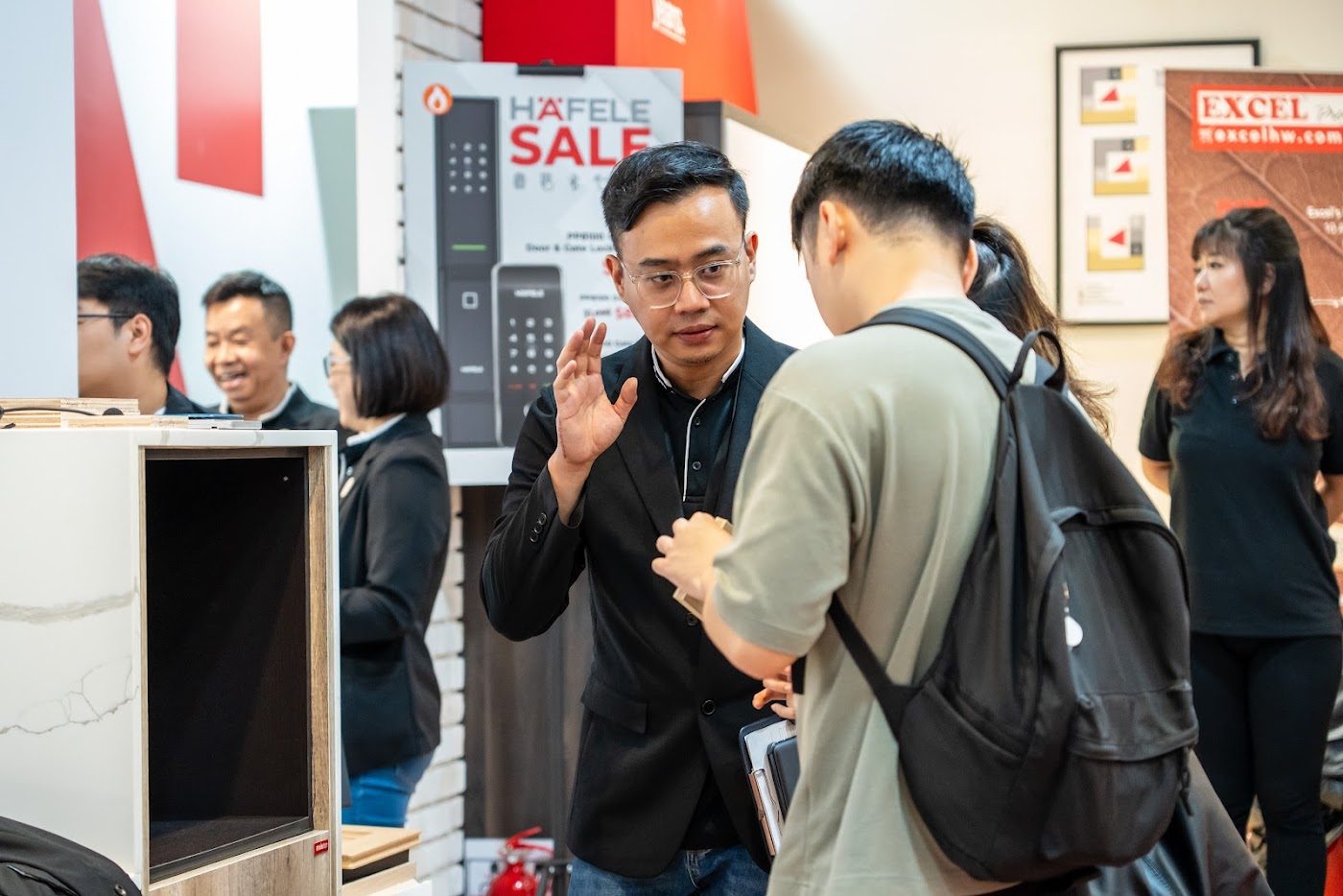 Homeowners at a Häfele product booth