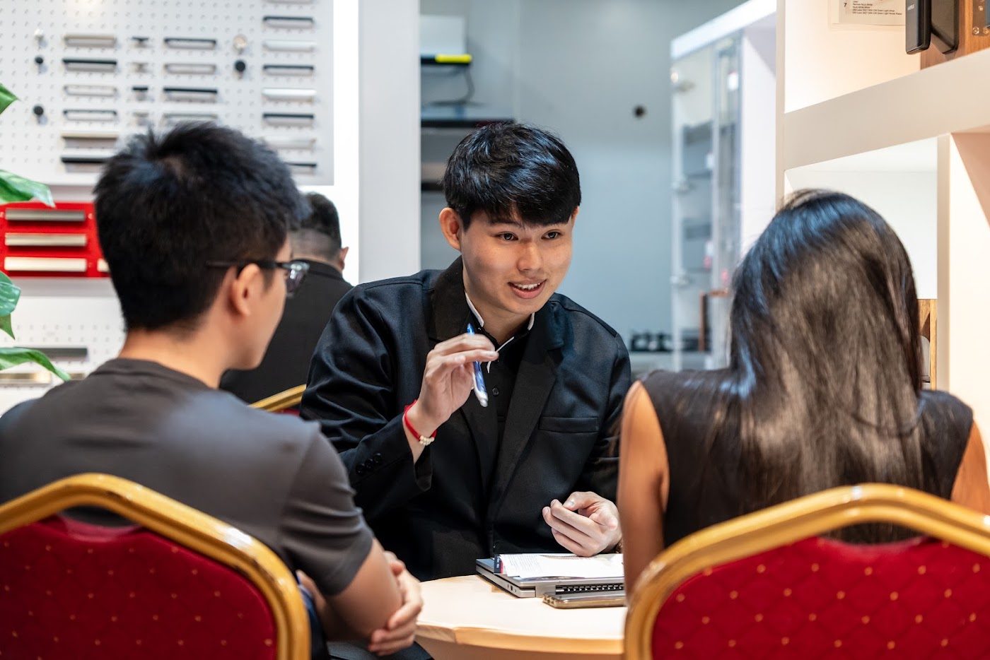 Interior designer explaining a quote at the event
